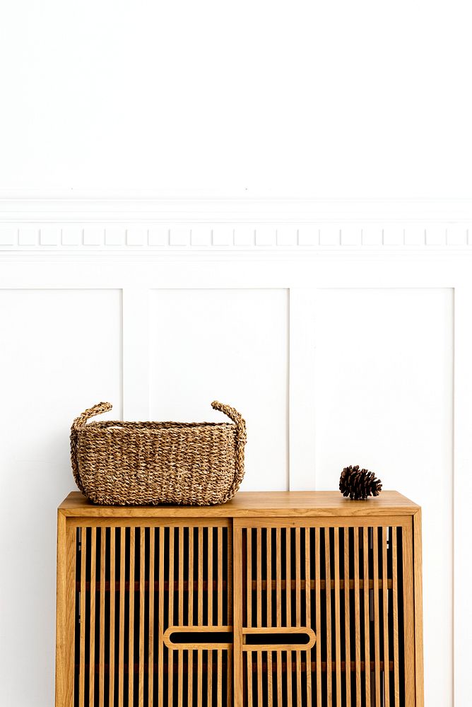 Wicker basket on a vintage wood cabinet