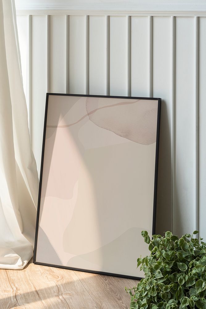 Blank picture frame mockup on parquet floor