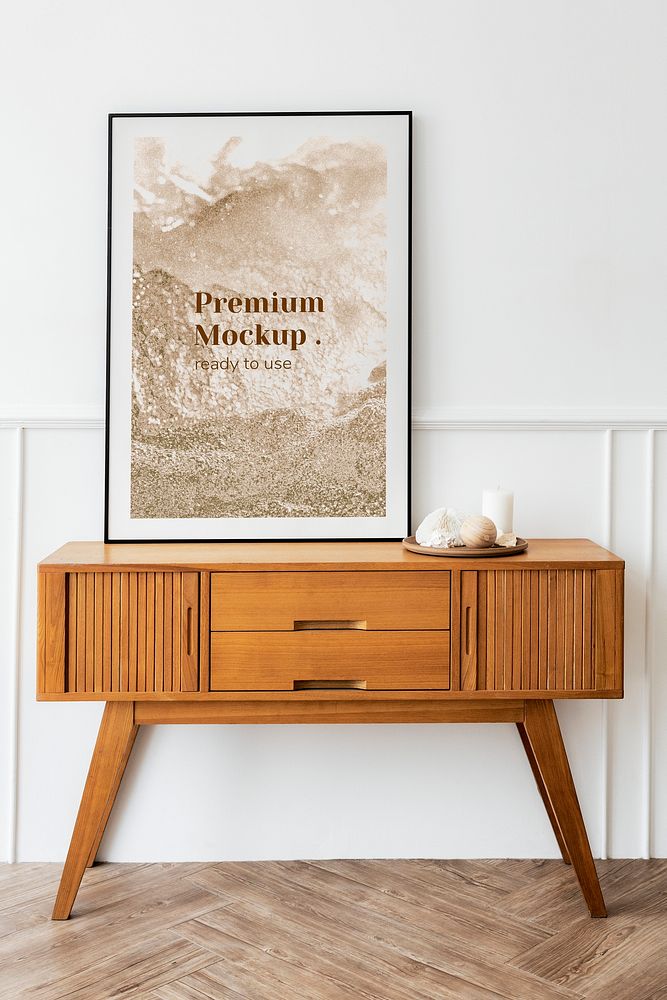 Picture frame mockup on a wooden sideboard table 