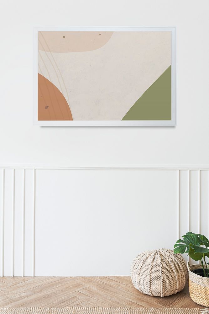 Picture frame mockup hanging in a minimal white room