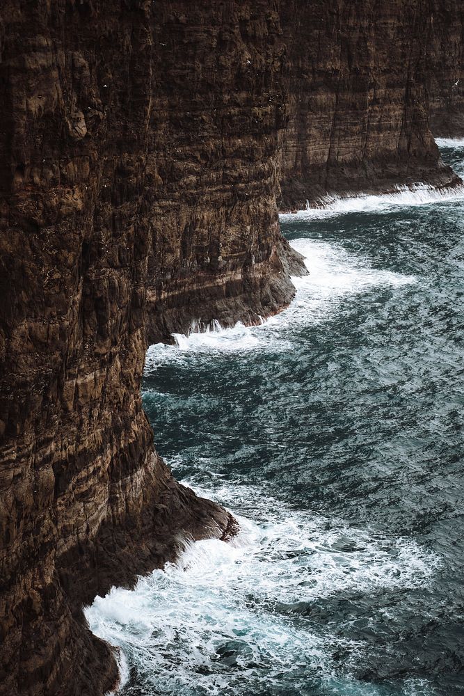 Waves hitting the cliffs on the Faroe Islands