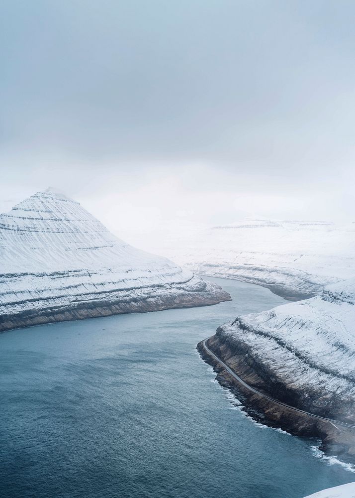 View of snowy Hv&iacute;thamar mountain in the Faroe Islands on a misty day