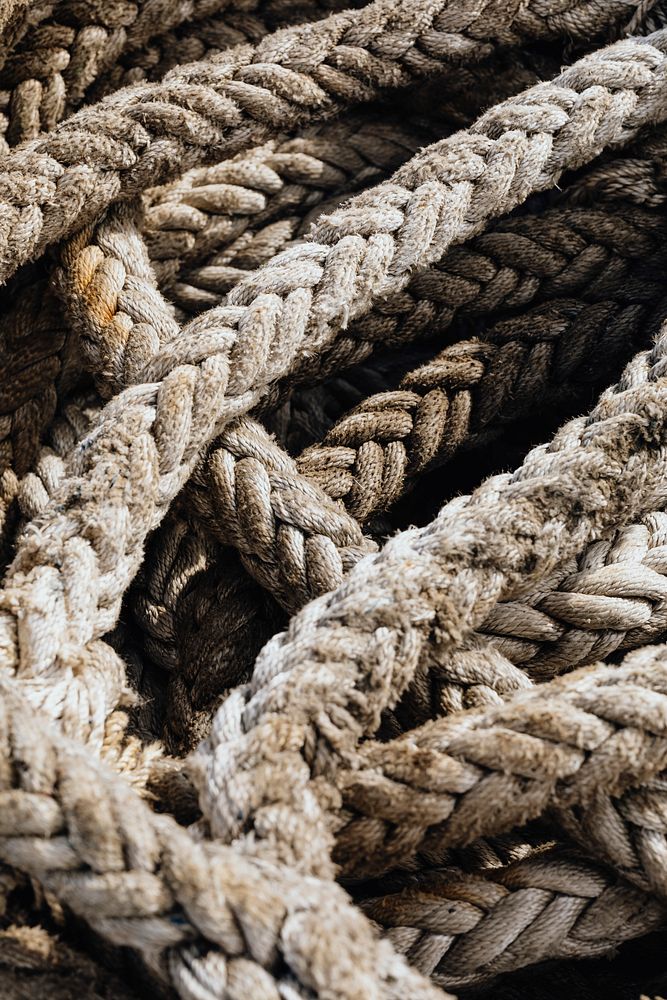Old weathered harbor ropes textured background