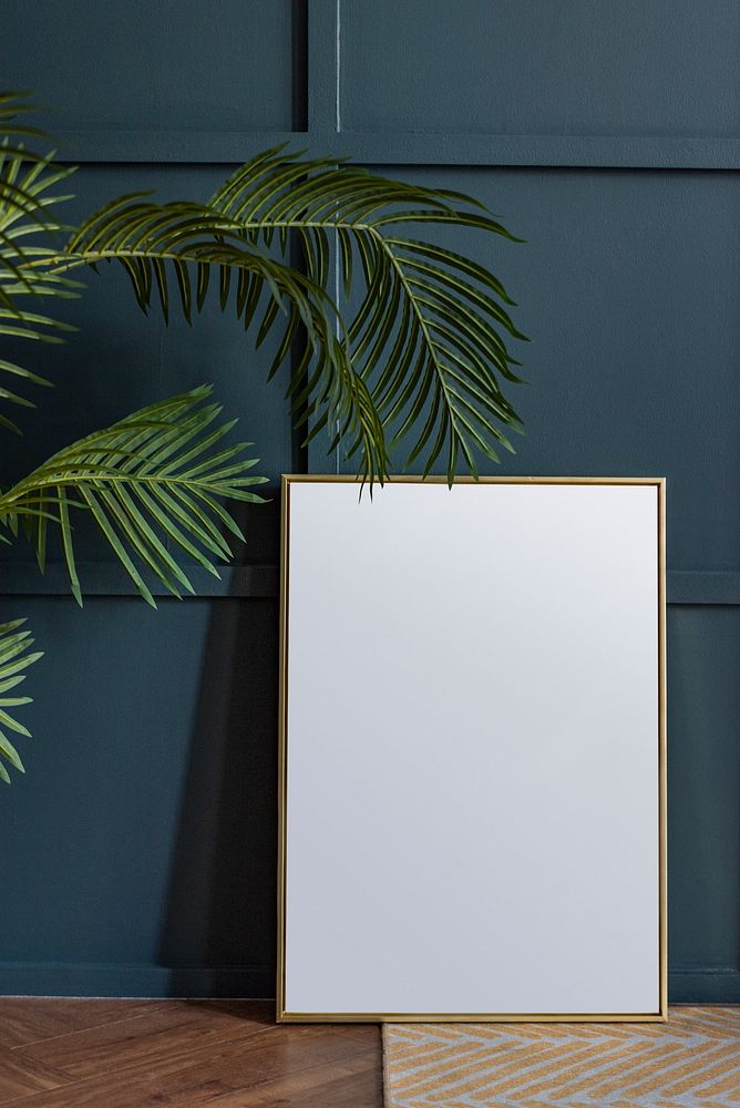 Blank picture frame against a wall