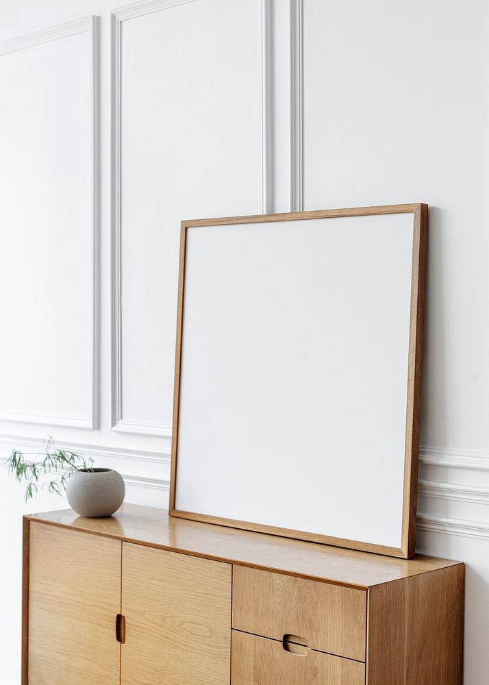 Blank picture frame on a cabinet