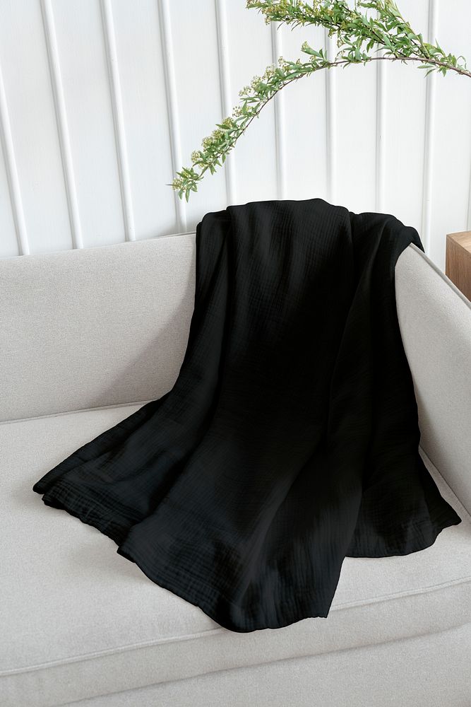Black throw blanket on a sofa