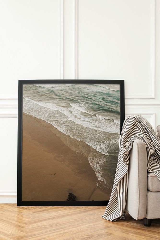 Seascape photo frame leaning on a white wall in modern luxury living room