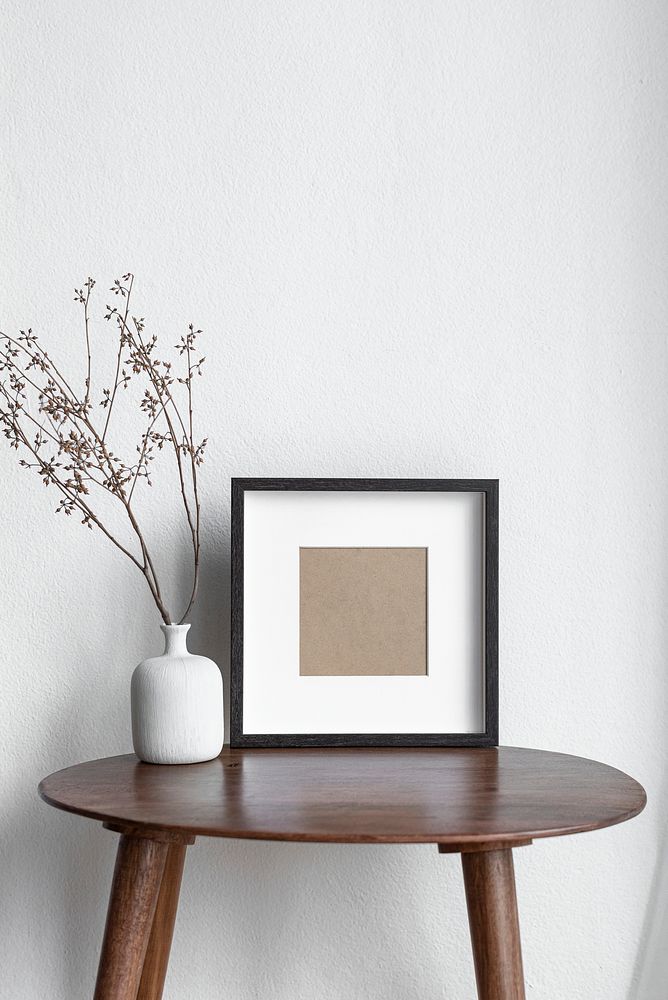 Blank tabletop picture frame on the living room’s table