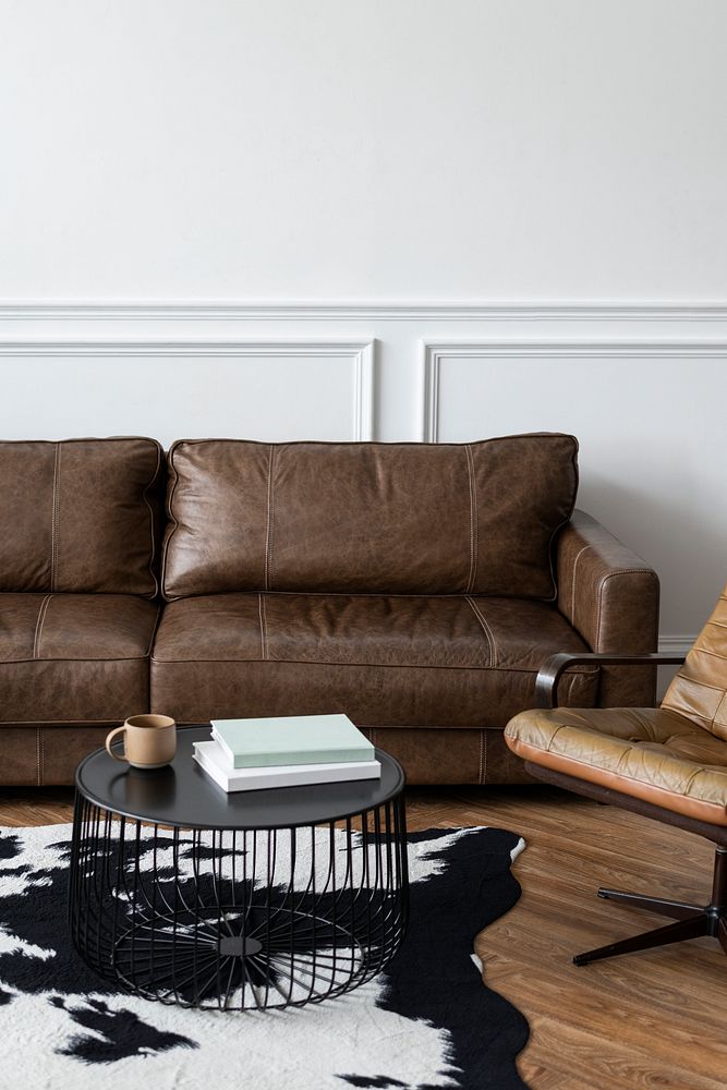 Modern industrial luxury style living room interior with leather couch and a coffee table