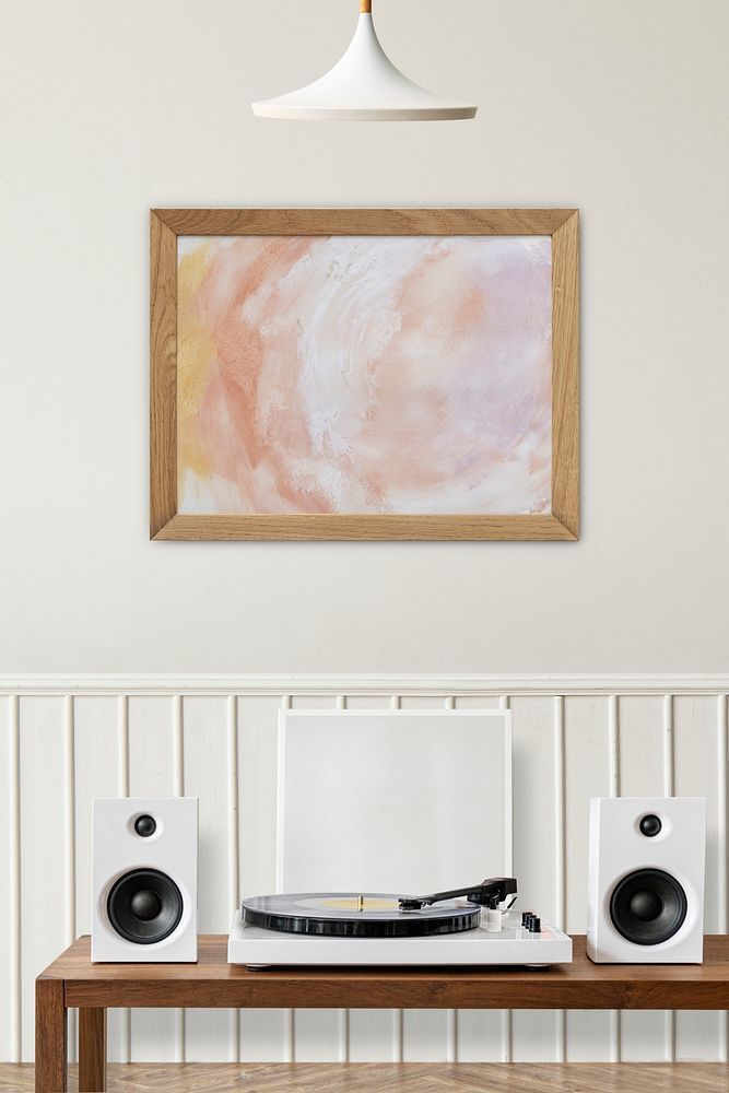 Picture frame mockup psd over a vinyl record player