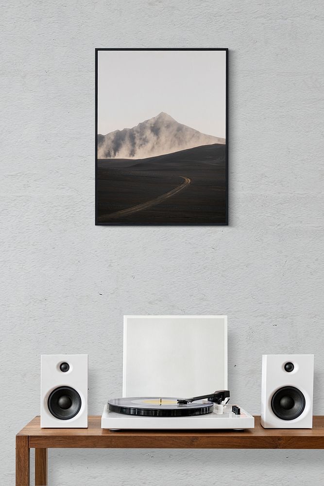 Picture frame mockup psd over a vinyl record player
