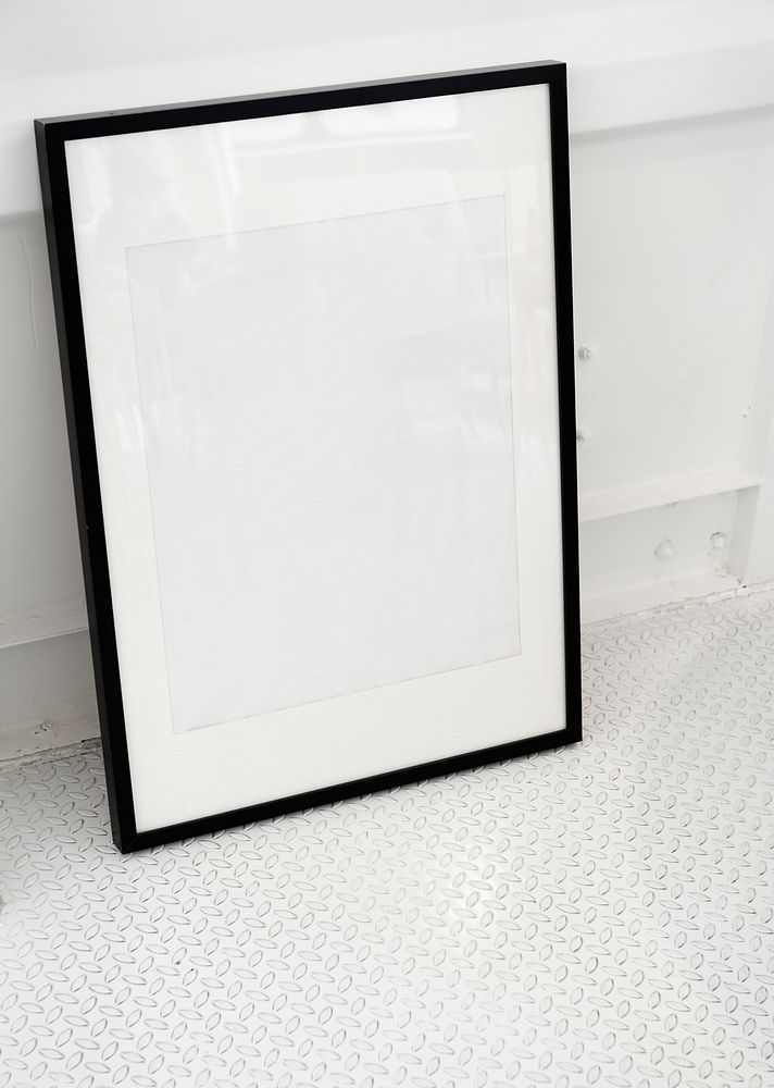 Blank mockup picture frame on a floor