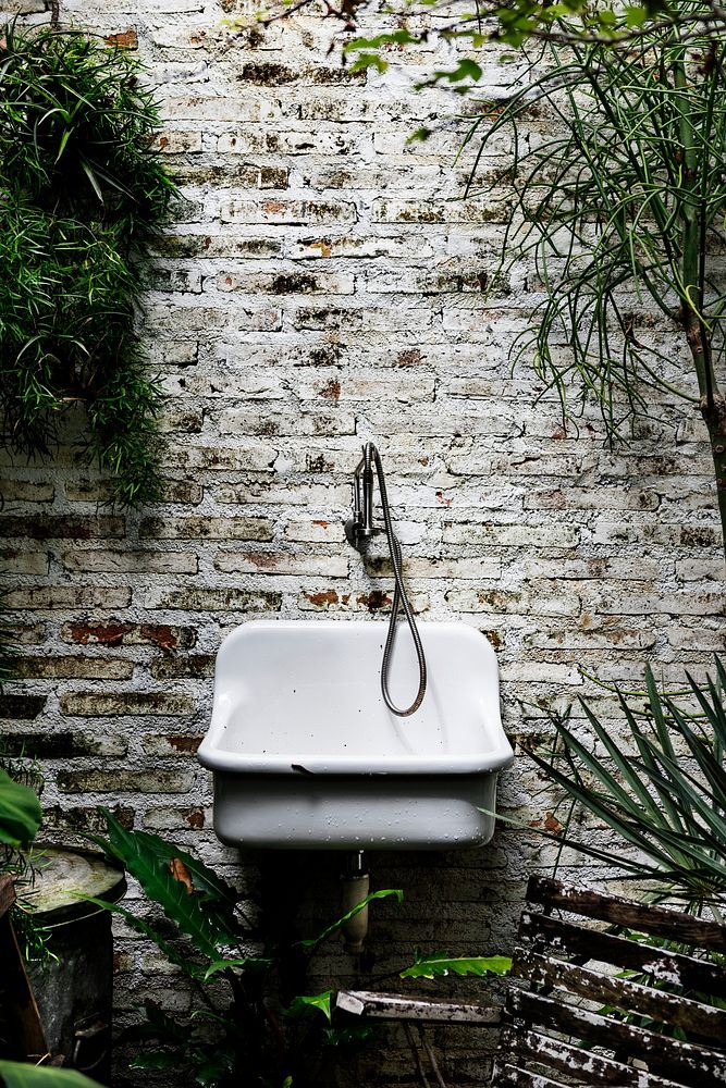 Sink on a garden themed wall