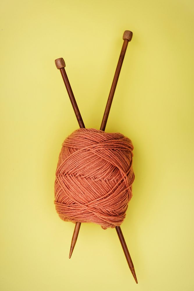 Flat lay of knitting needle and yarn