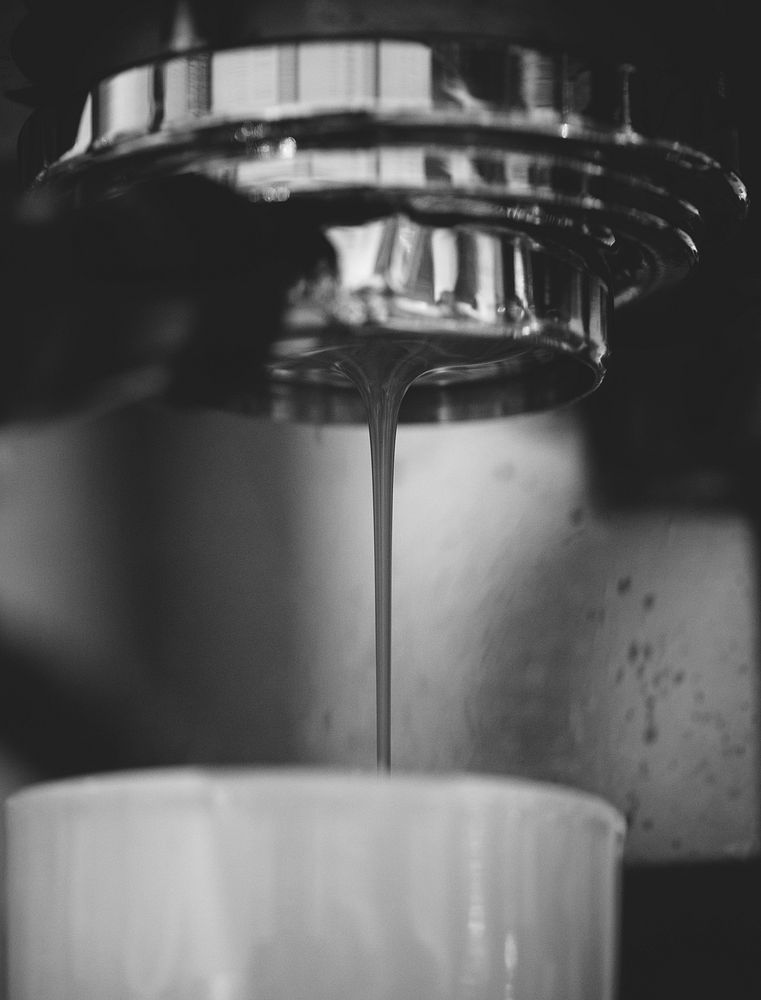 Closeup of coffee machine making espresso drink