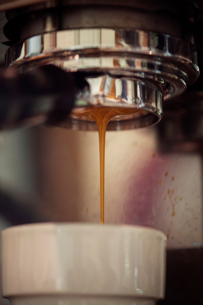 Closeup of coffee machine making espresso drink