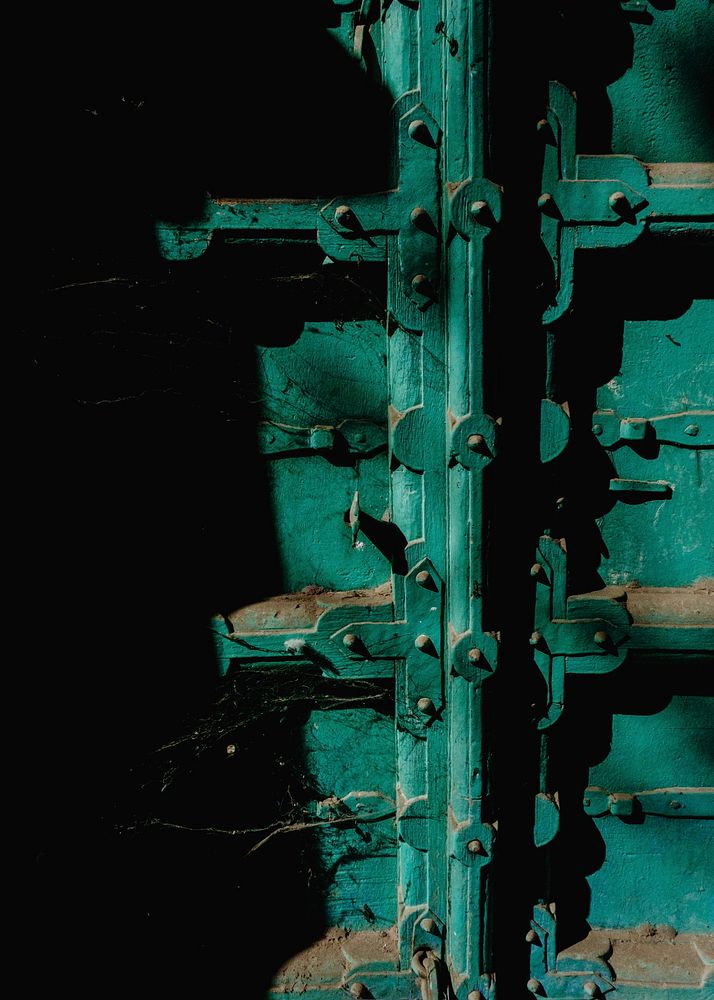 Closeup of green dusty door