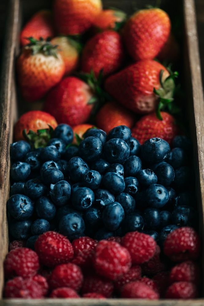 Fresh berries in a wooden box