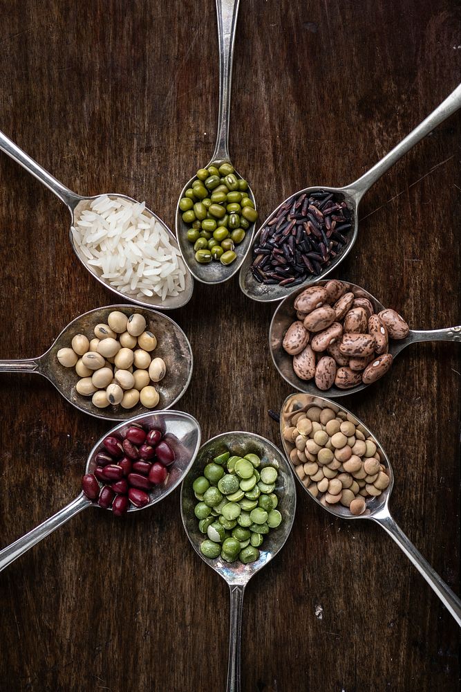 Various types of beans on spoons