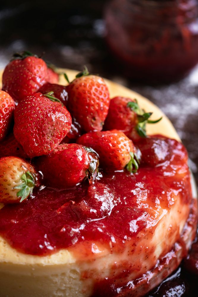 Closeup of a cheesecake topped with strawberries