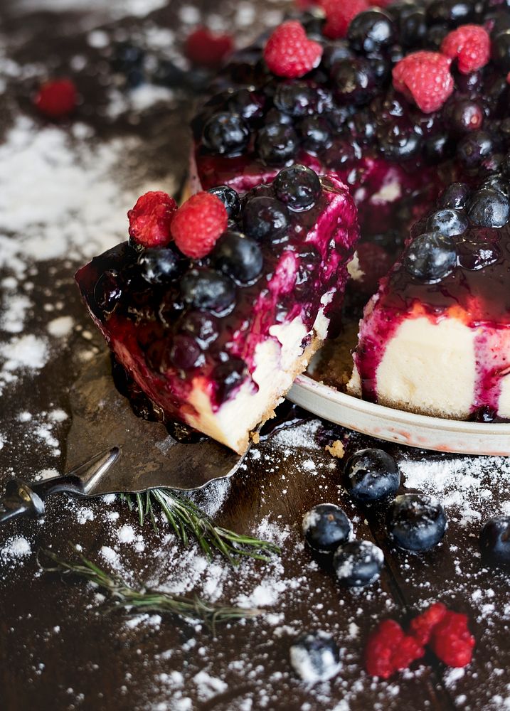 Closeup of a berries cheesecake with a slice cut out