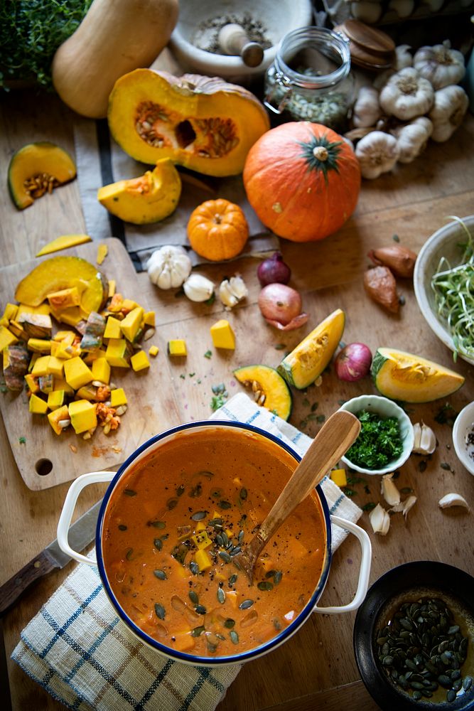 Pot of pumpkin soup on a table