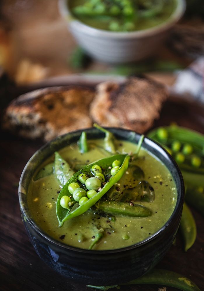 Close up of a green pea soup in a bowl