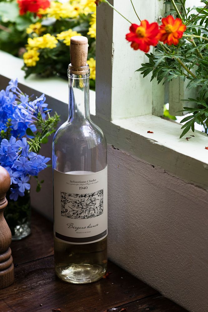 A bottle of white wine with flowers