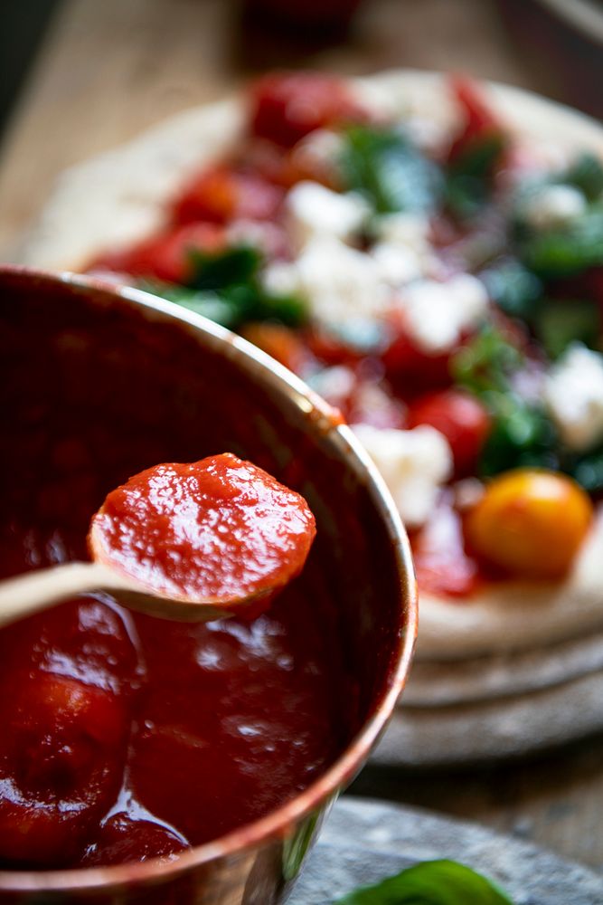 Homemade pizza and tomato sauce food photography recipe idea
