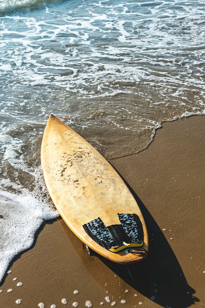 Surfboard on a sandy beach