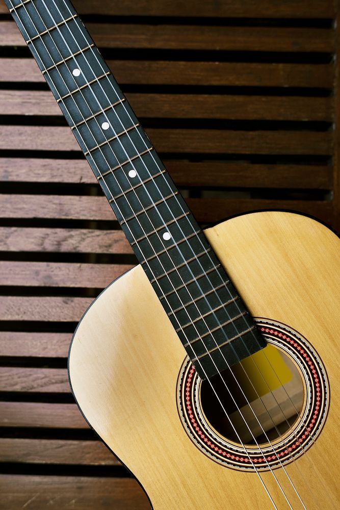 Acoustic guitar on a wooden floor