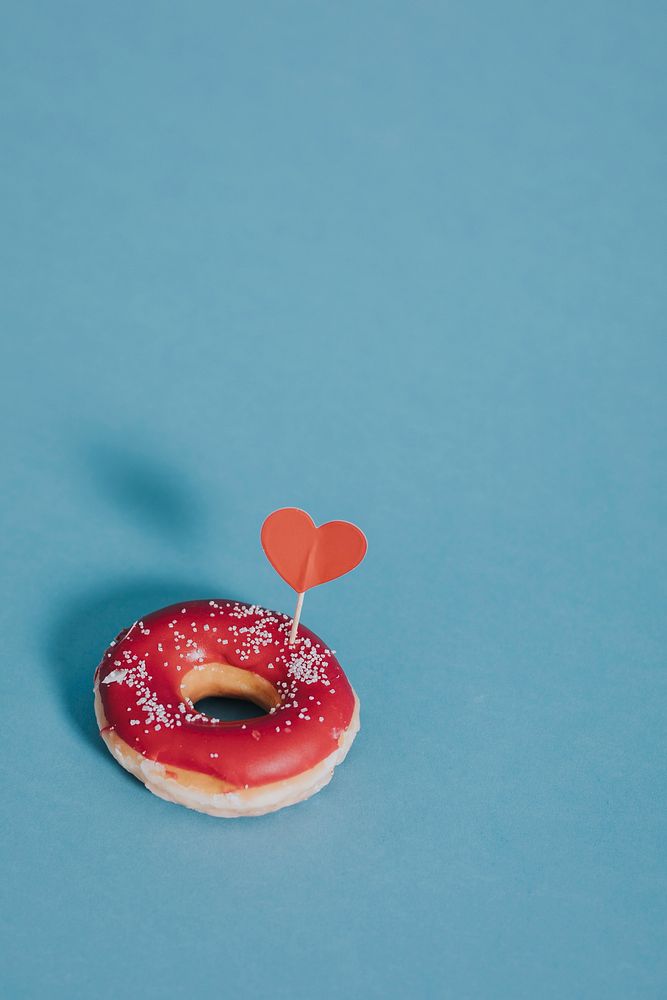 Tasty glazed donut decorated with a heart