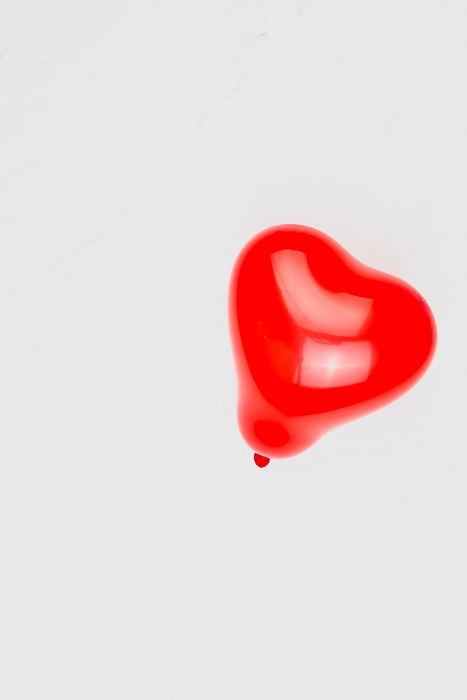 Red blown up heart shaped balloon