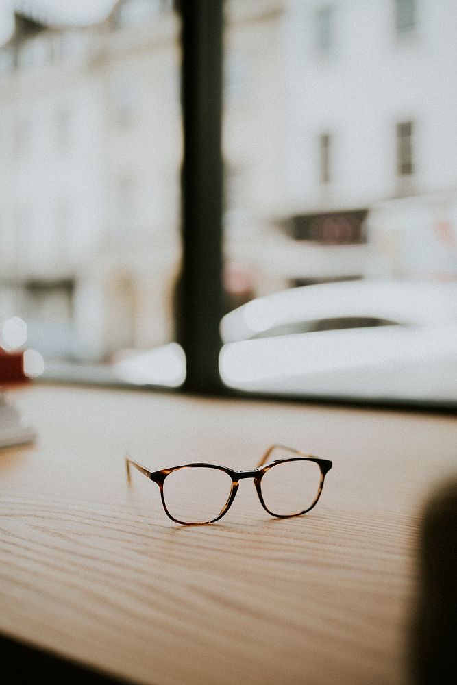 Pair of glasses on a wooden table