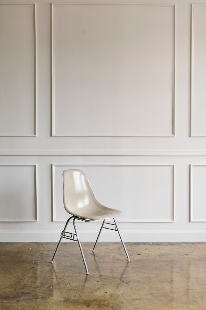 White wall with a brown marble floor