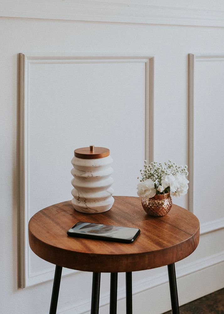 Cute copper plant pot on a wooden table