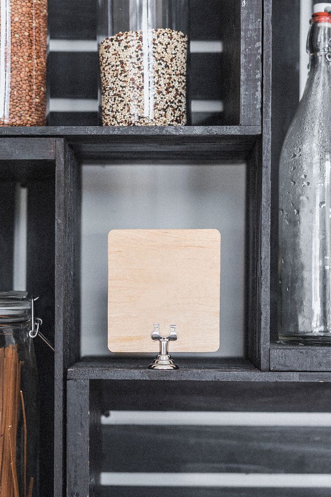 Dry grains in containers by a wooden board