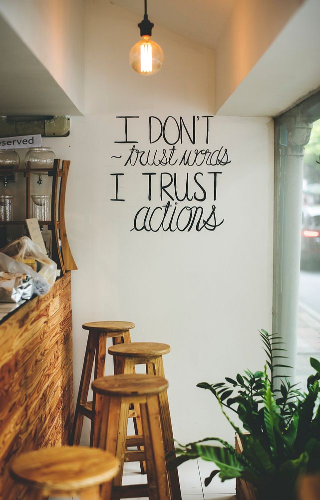I don't trust words, I trust actions inspirational quote on a wall