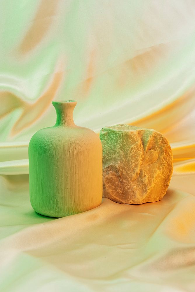 Modern ceramic vase next to a stone