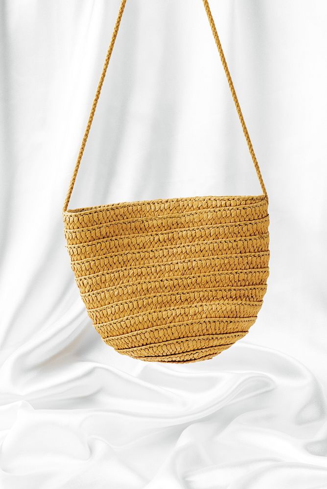 Straw woven bag mockup against a white sheet 