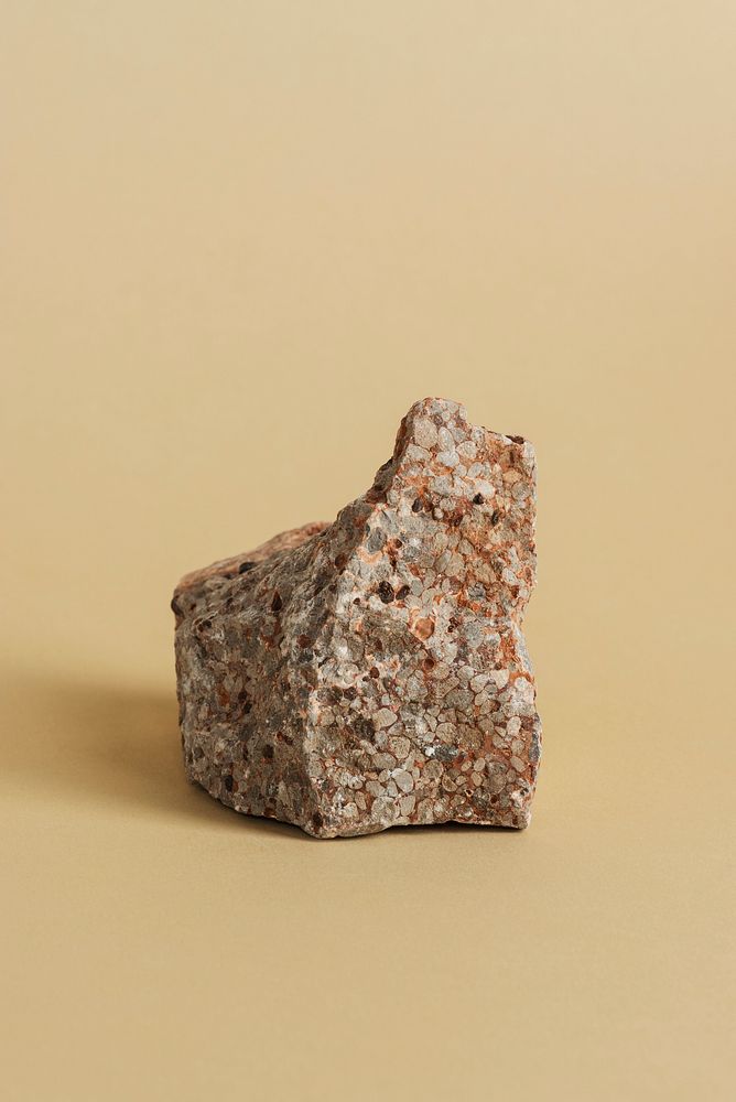 Stone paperweight on beige background