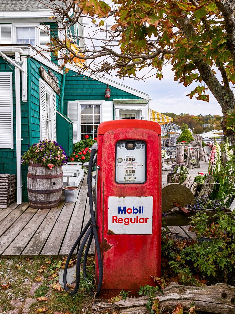 Old gas pump in the garden of the Chowder House Boat Bar in Boothbay Harbor, Maine. Original image from Carol M.…