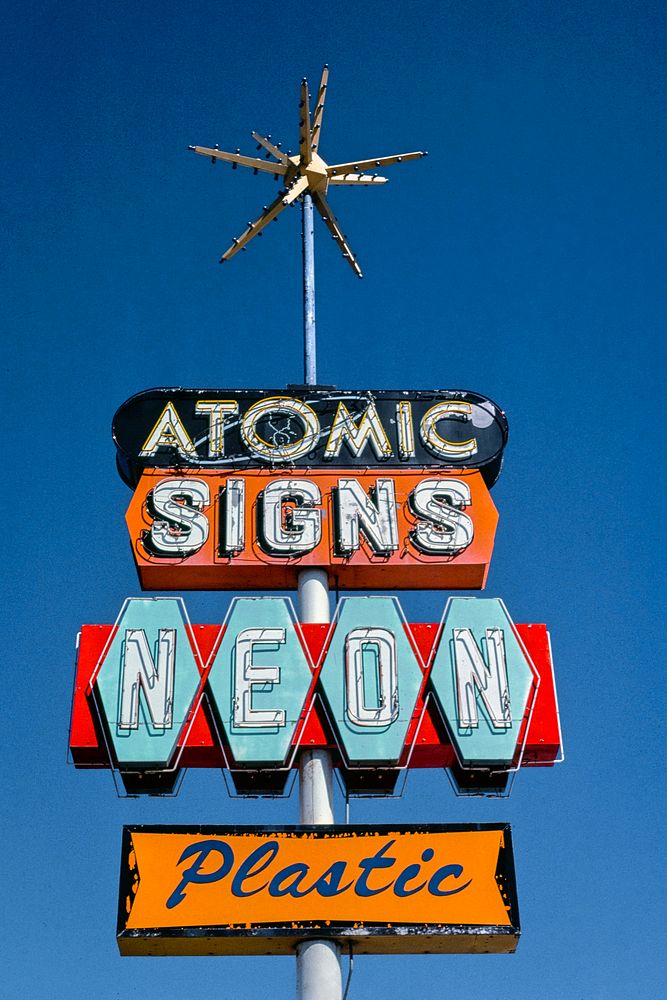 Atomic Signs sign, Route 550, Farmington, New Mexico (1980) photography in high resolution by John Margolies. Original from…