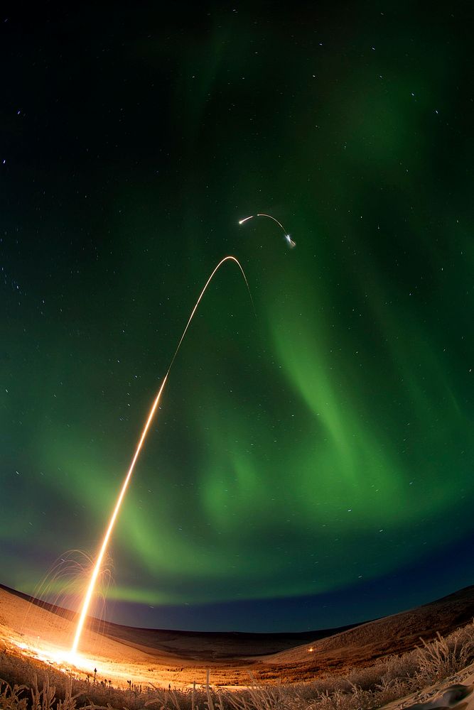 Sounding rocket launches successfully from Alaska and a green aurora dancing over Alaska. All four stages of the rocket are…