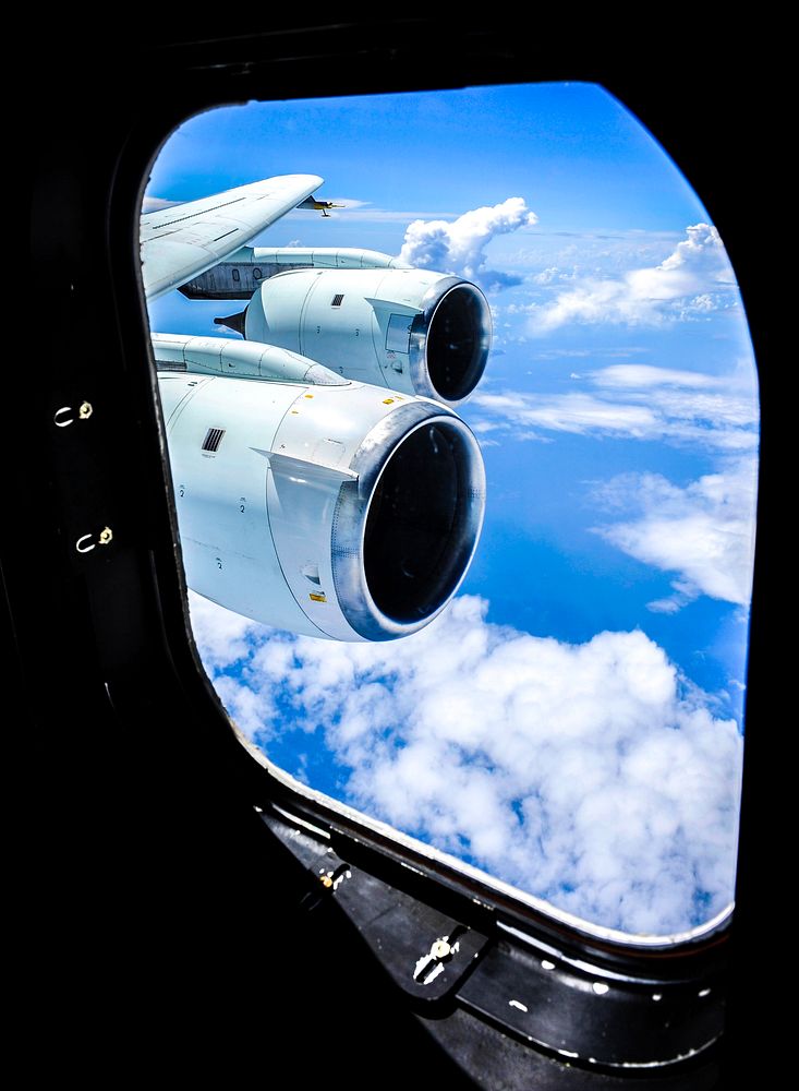 Cloud formations are seen through the window of NASA DC-8 aircraft during a flight over the Gulf of Mexico, Aug. 17, 2010.…