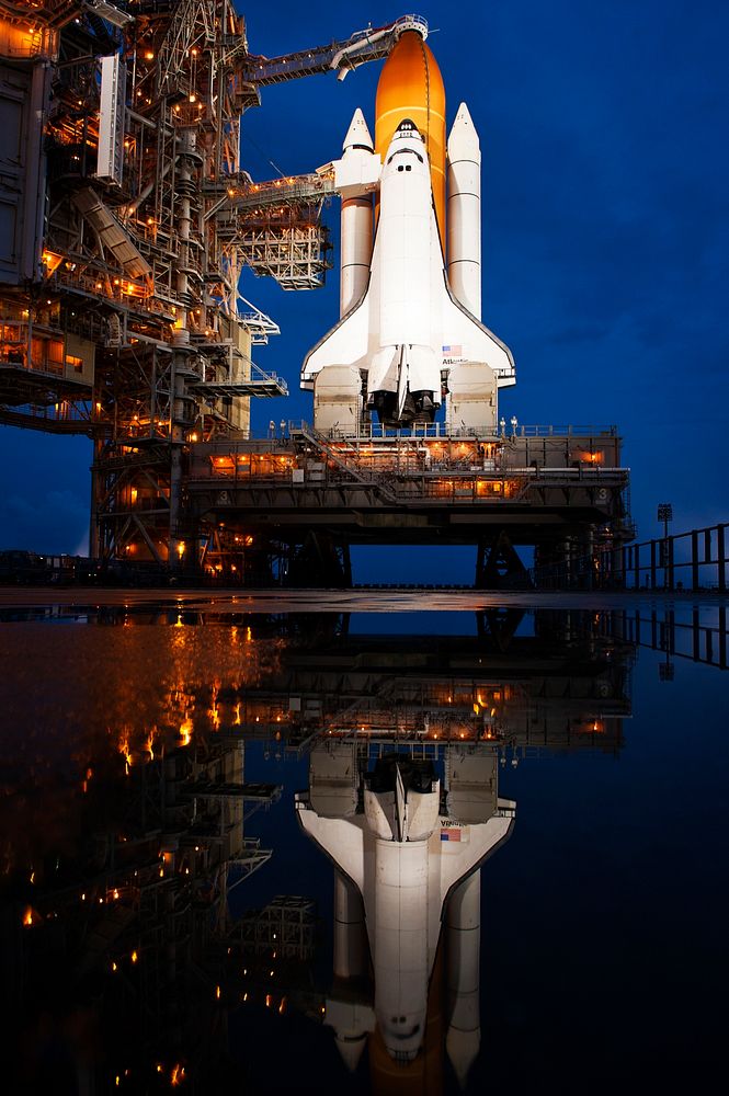 The space shuttle Atlantis is seen shortly after the rotating service structure (RSS) was rolled back at launch pad 39a…