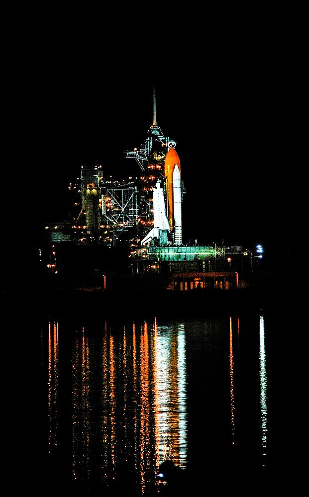 Space shuttle Atlantis, attached to its bright-orange external fuel tank and twin solid rocket boosters on Launch Pad 39A at…