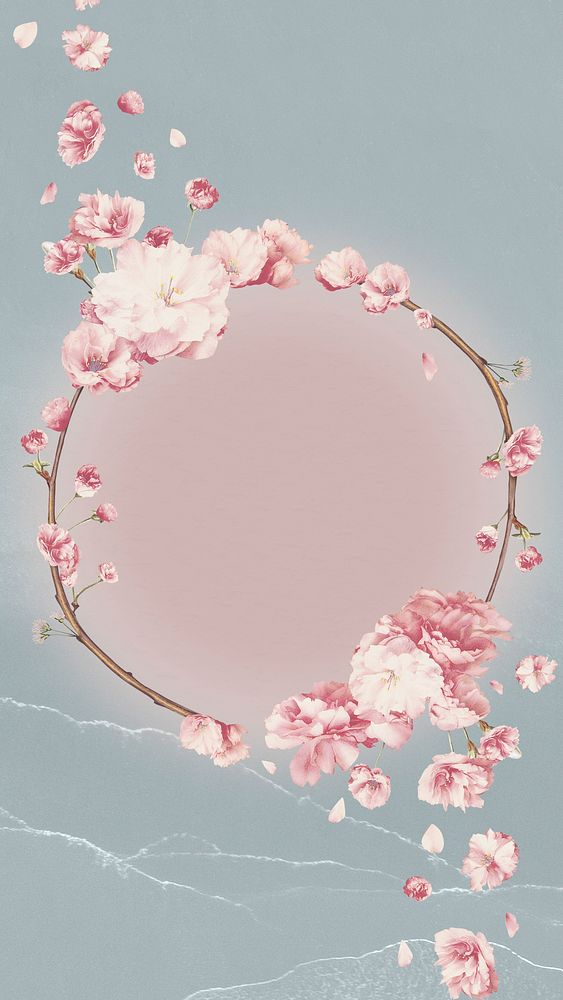 Round pink cherry blossom flower bouquet border frame on blue paper texture background
