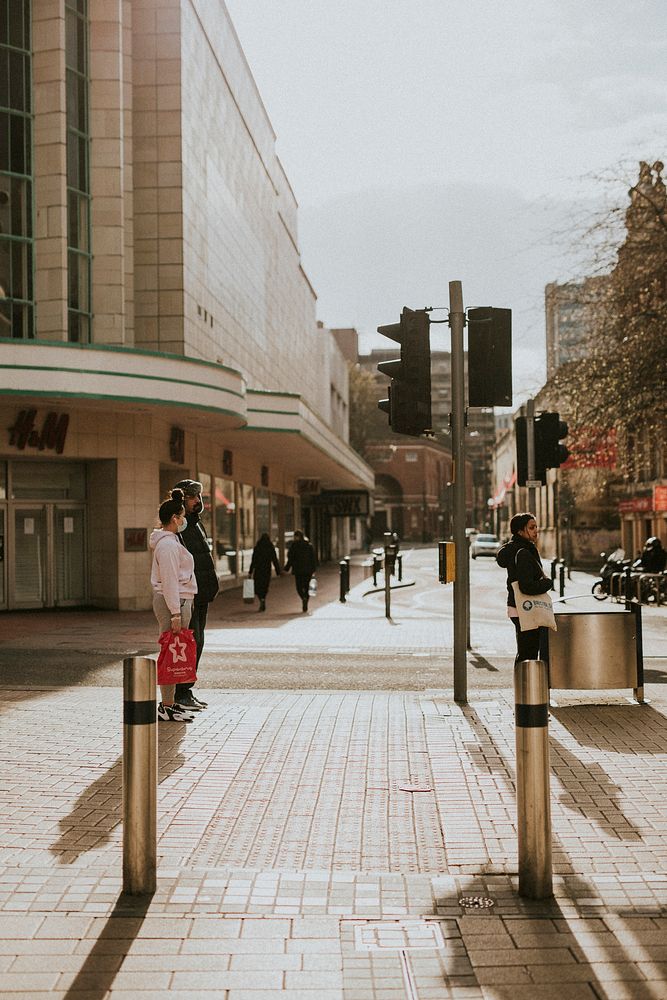 Social distancing while waiting to cross the street during coronavirus pandemic. BRISTOL, UK, March 30, 2020