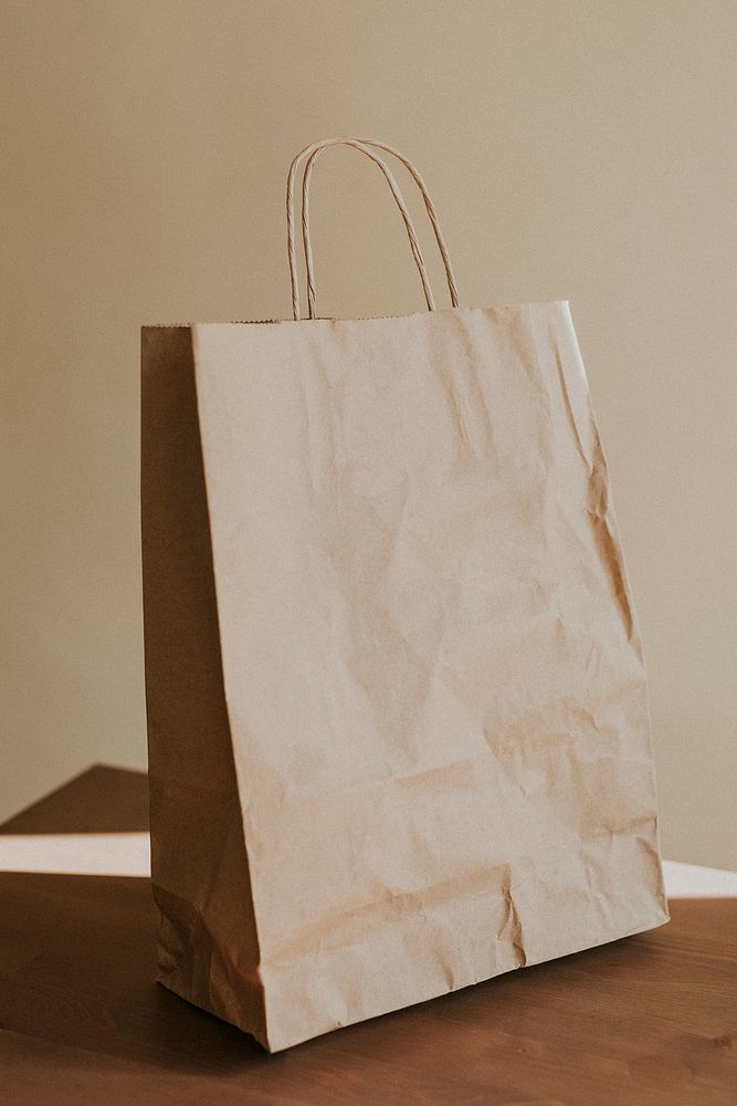 Natural brown paper bag on wooden table